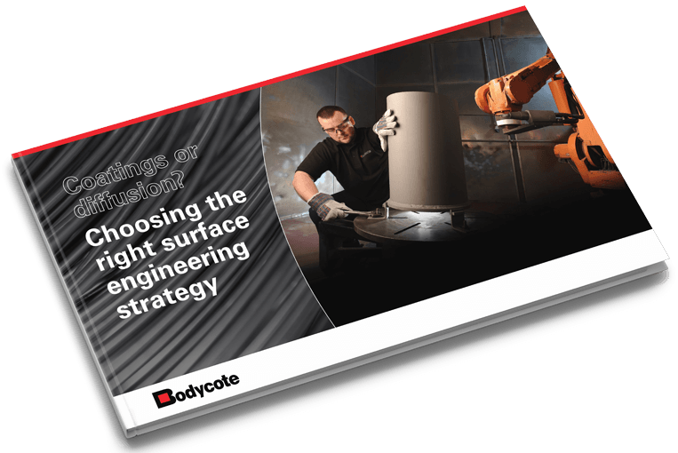 Booklet cover titled “Choosing the right surface engineering strategy” featuring a person operating industrial machinery, Bodycote logo at the bottom, and the question “Coatings or diffusion?” displayed prominently.